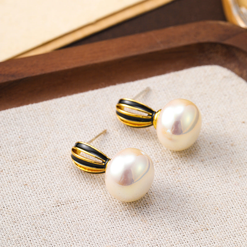 925 silver needle new hollow pumpkin oil drop pearl earrings for women, high-end niche, unique and simple women's earrings