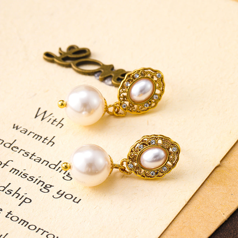 French retro palace style hollow flower plate pearl earrings niche design 925 silver needle earrings