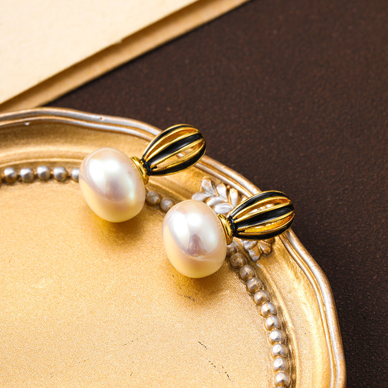 925 silver needle new hollow pumpkin oil drop pearl earrings for women, high-end niche, unique and simple women's earrings