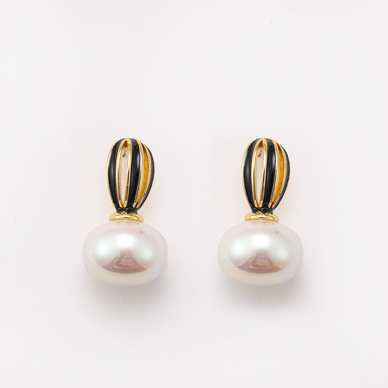 925 silver needle new hollow pumpkin oil drop pearl earrings for women, high-end niche, unique and simple women's earrings