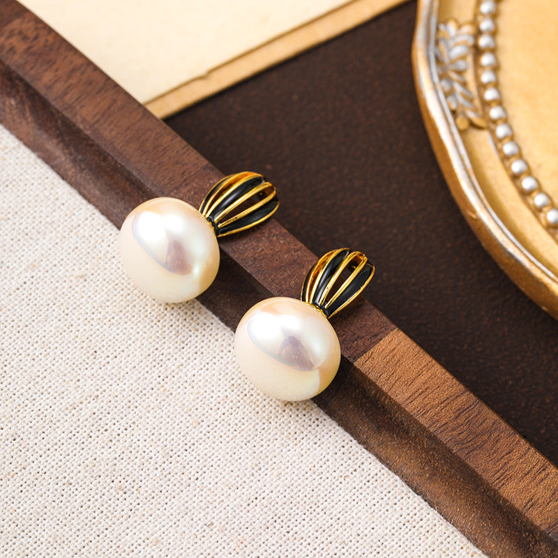 925 silver needle new hollow pumpkin oil drop pearl earrings for women, high-end niche, unique and simple women's earrings