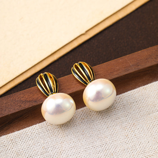 925 silver needle new hollow pumpkin oil drop pearl earrings for women, high-end niche, unique and simple women's earrings