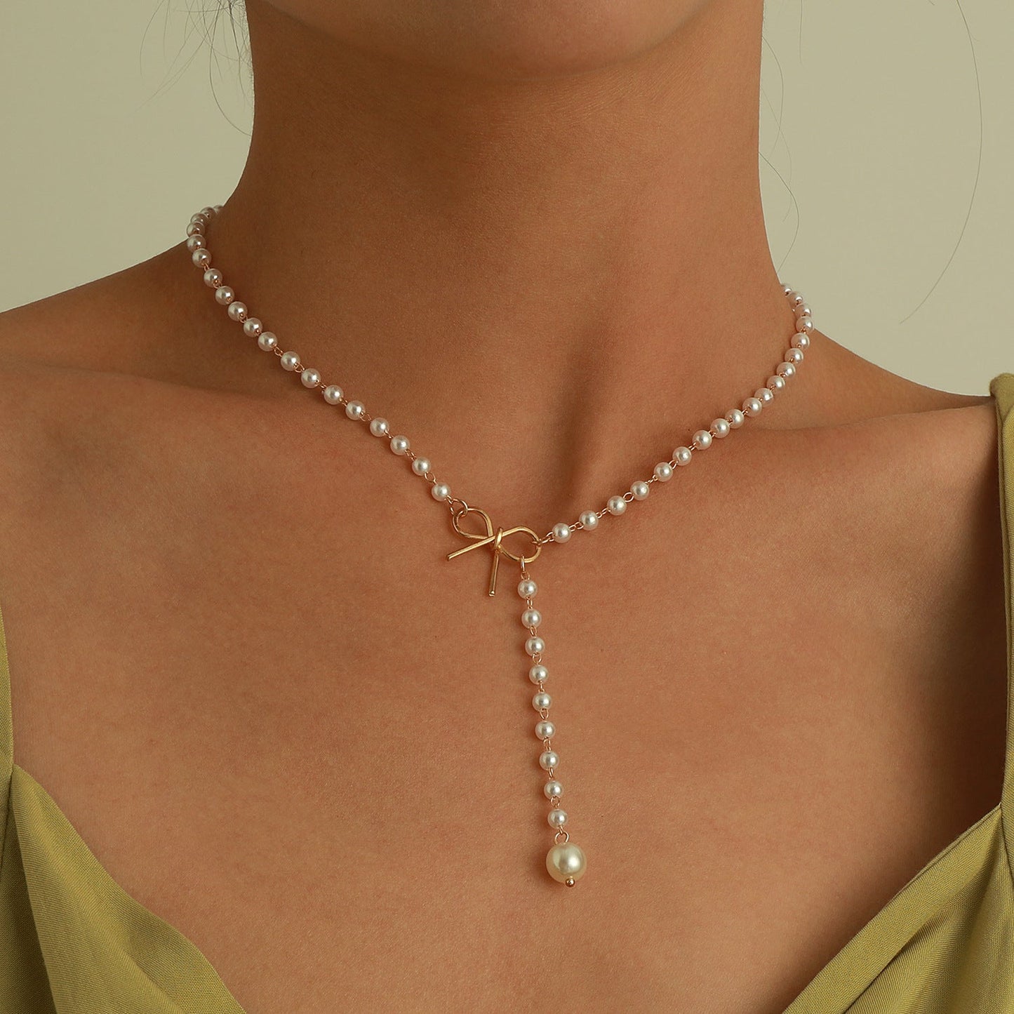 Alloy Bow Pearl Tassel Pendant Necklace